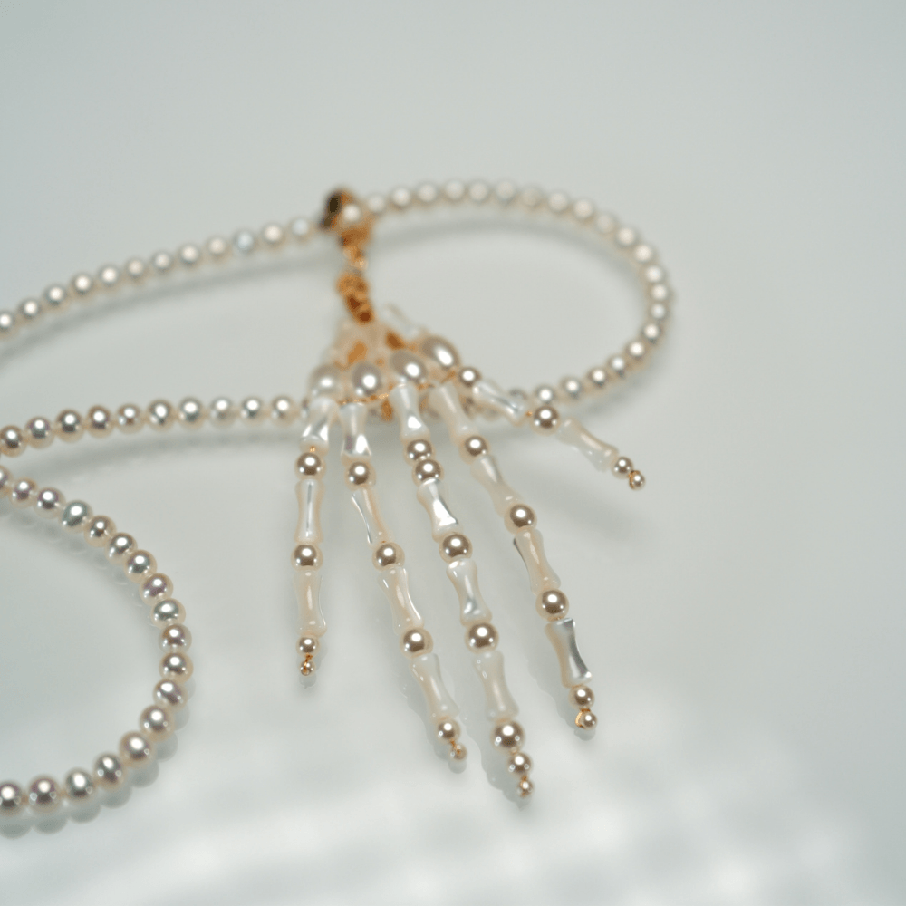 Lunather™ Poseable Pearl Skeleton Hand Necklace