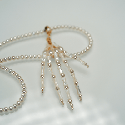 Lunather™ Poseable Pearl Skeleton Hand Necklace
