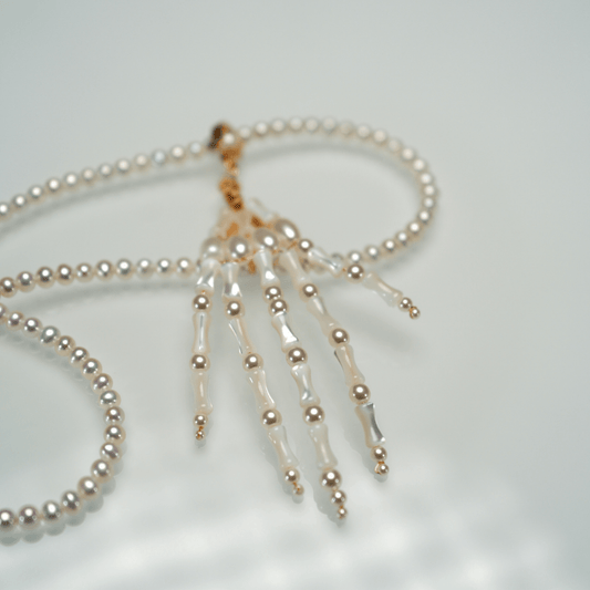 Lunather™ Poseable Pearl Skeleton Hand Necklace