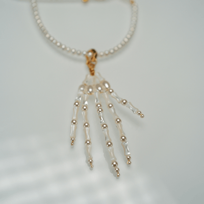 Lunather™ Poseable Pearl Skeleton Hand Necklace