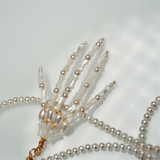 Lunather™ Poseable Pearl Skeleton Hand Necklace